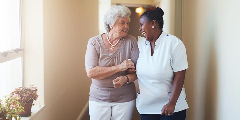 Elderly Woman with Caregiver